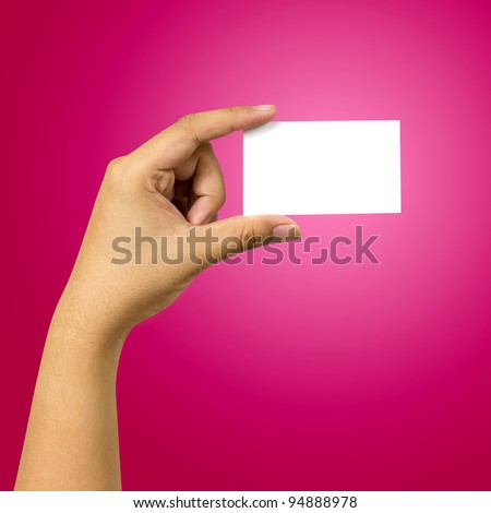 hand holding business card against red background