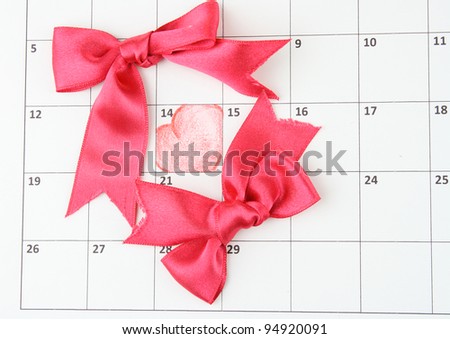 Calendar page with hearts and bows on St.Valentines Day