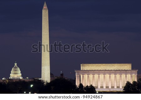 View of Washington DC with Capitol, Washington Monument and Lincoln Memorial in line, at dusk