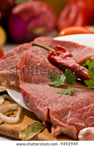 macro picture of meat and vegetables on the wood board
