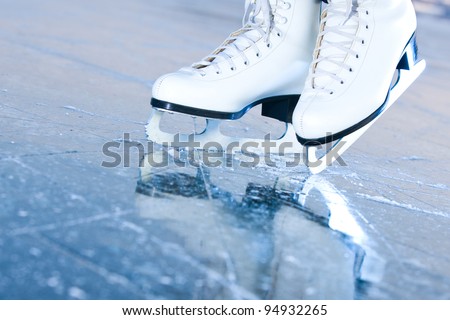 Tilted blue version, ice skates with reflection Royalty-Free Stock Photo #94932265