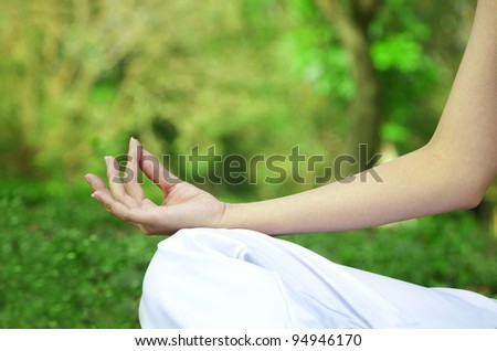 Closeup of woman hands in yoga pose