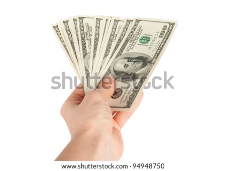 Hand with $100 banknotes stack isolated on white background