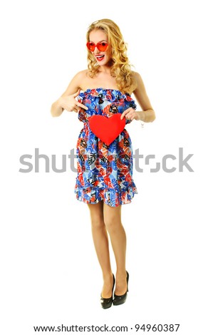 Pretty blond pinup girl holding heart shape  - valentine day concept