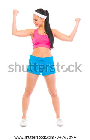 Healthy girl checking muscles