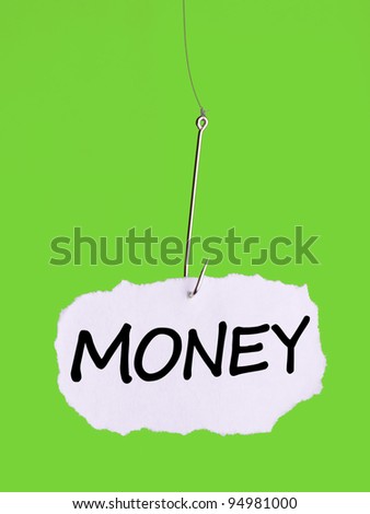 Word MONEY on a fishing hook on green background