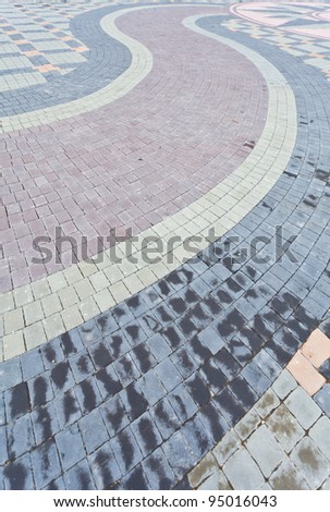 Colored weathered concrete floor bricks