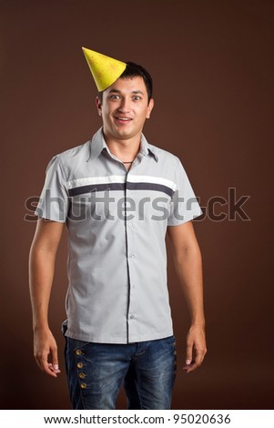An image of a young fellow in a yellow cap