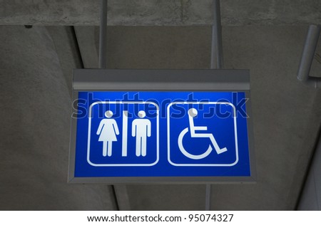  Men and women toilet sign with an arrow showing direction