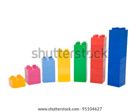 Achievement chart from multicolored building blocks. Isolated on white. Ready for your text, symbol or logo.