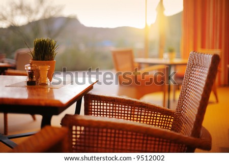 Natural restaurant interior with scenic view at sunset Royalty-Free Stock Photo #9512002