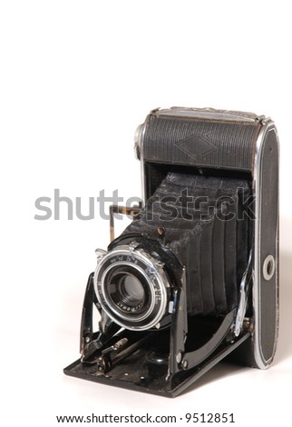 Old vintage photo camera isolated