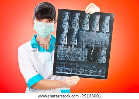 Doctor with xray on a red background