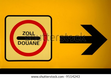 a yellow indicator board with arrow and duane