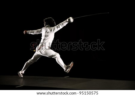 swordsman isolated on black background Royalty-Free Stock Photo #95150575