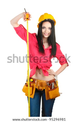 beautiful young girl-builder  holding building roulette isolated on white
