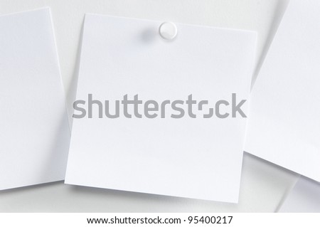 Blank paper, hanging on the wall with a pushpin