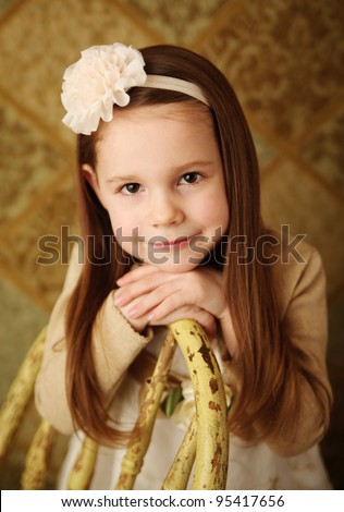 Portrait of a cute young girl wearing a flower headband in studio