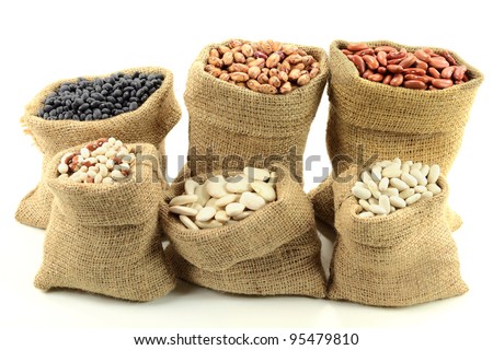 Stock Photo of Different kinds  Bean Seeds (legume, pulse) in burlap bags (sacks) front view  over white background.