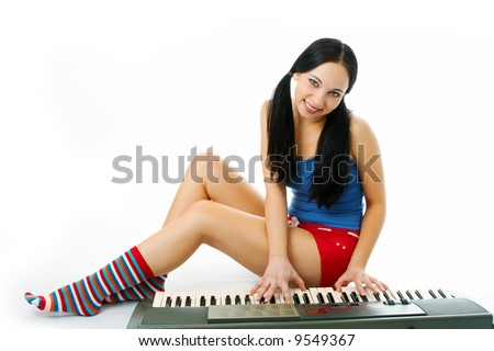 young woman play piano on white background