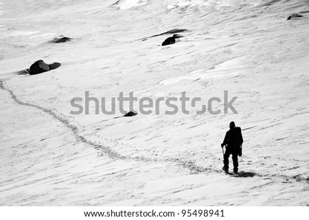 Alpinist traversing a glacier