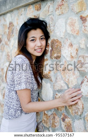 Cute young asian woman portrait outdoor scene.