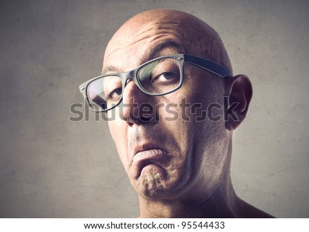 Bald man with snobbish expression Royalty-Free Stock Photo #95544433
