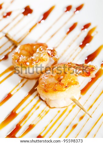 Fried Prawn Skewer decorated with teriyaki sauce