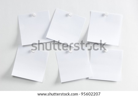 Blank paper, hanging on the wall with a pushpin
