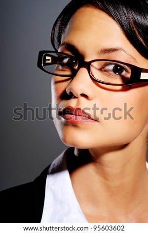 Asian woman in business suit with spectacles