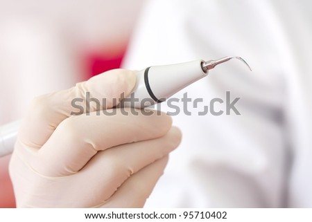 Periodontal ultrasonic scalers are dental instruments used primarily in the prophylactic and periodontal care of human teeth - tartar removal. Royalty-Free Stock Photo #95710402