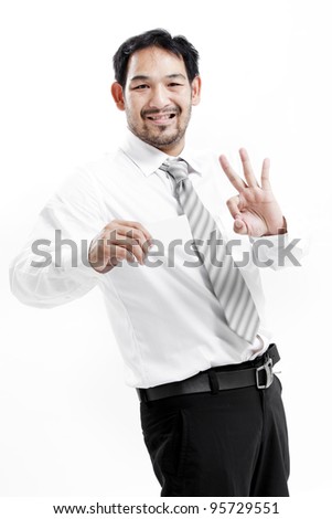 Business man handing a blank business card over white background