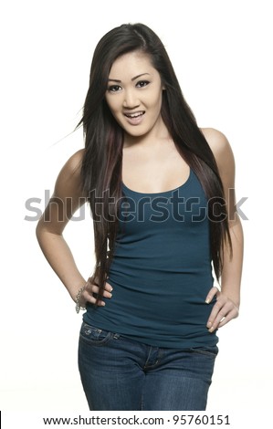 Pretty slender asian teenage girl on white background, casual clothing
