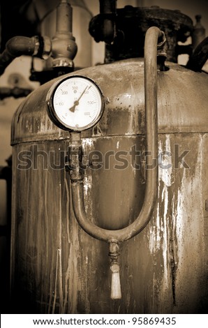 thermometer close-up in old rusty industrial boiler room