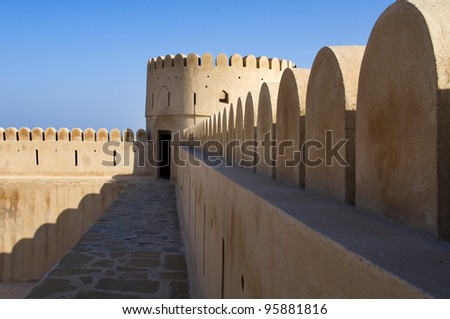 Historic adobe fortification, watchtower of Sunaysilah Castle or Fort in Sur, Al Sharqiya Region. Sultanate of Oman, Middle East