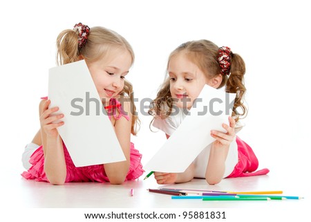 two girls drawing with color pencils together over white
