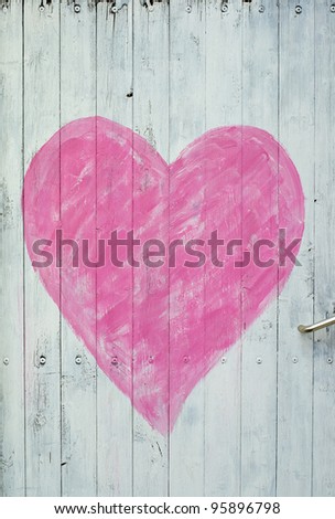 A white wooden door with a pink heart Royalty-Free Stock Photo #95896798