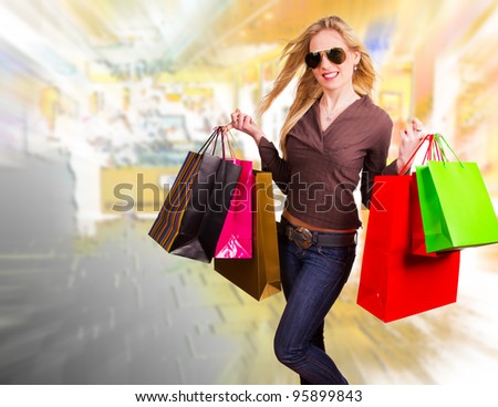 Happy blond woman with shopping bags