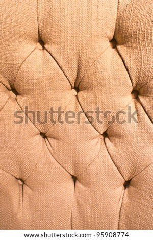 Close up of the pattern of the covering of an old chair