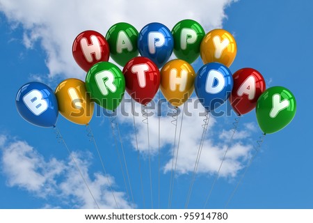 Colorful happy birthday balloons in front of blue sky