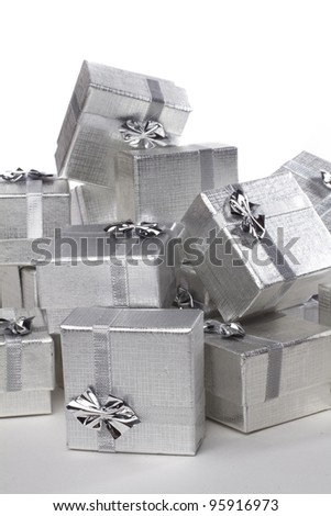 Many silver gifts in a pile macro