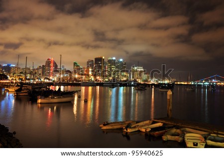 View of the downtown San Diego skyline and harbor at night in Southern California.