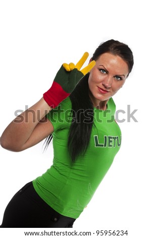 Pretty young woman in green t-shirt with word Lithuania showing victory sign. isolated against white background
