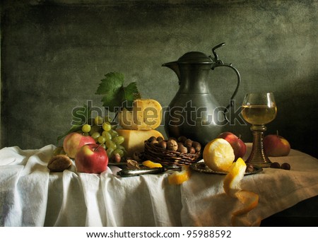 Classical still life with fruit, cheese, nuts and wine Royalty-Free Stock Photo #95988592
