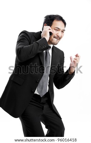 Superstitious - Asian business man with crossed fingers over white background