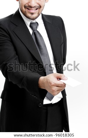 Business man handing a blank business card over white background