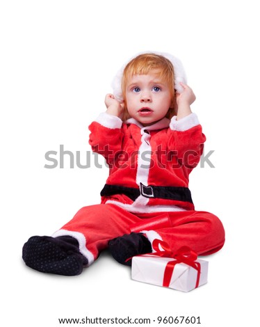Portrait of little cute baby in red suite of Santa  isolated over white