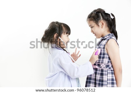 Children playing doctor, isolated on white