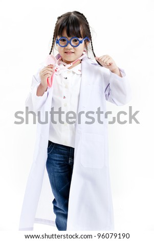 A young asian girl having fun playing dress up as a doctor