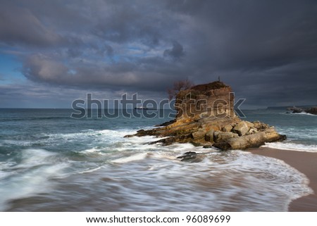 Storm clouds over the island in sea